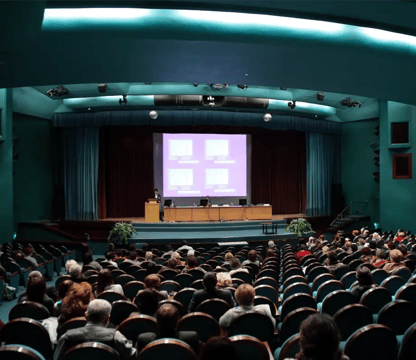 Large auditorium with presentation happening