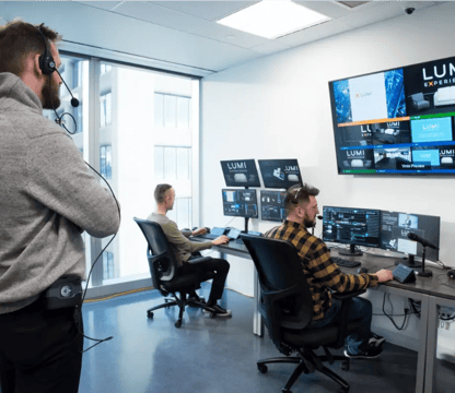 Technical support team working on multiple monitors