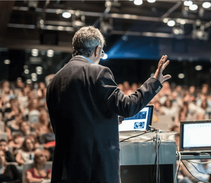 Man giving presentation to large room