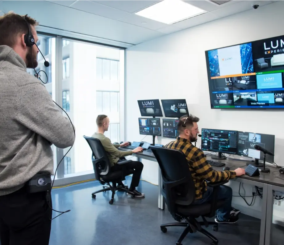 Technical support team working on multiple monitors
